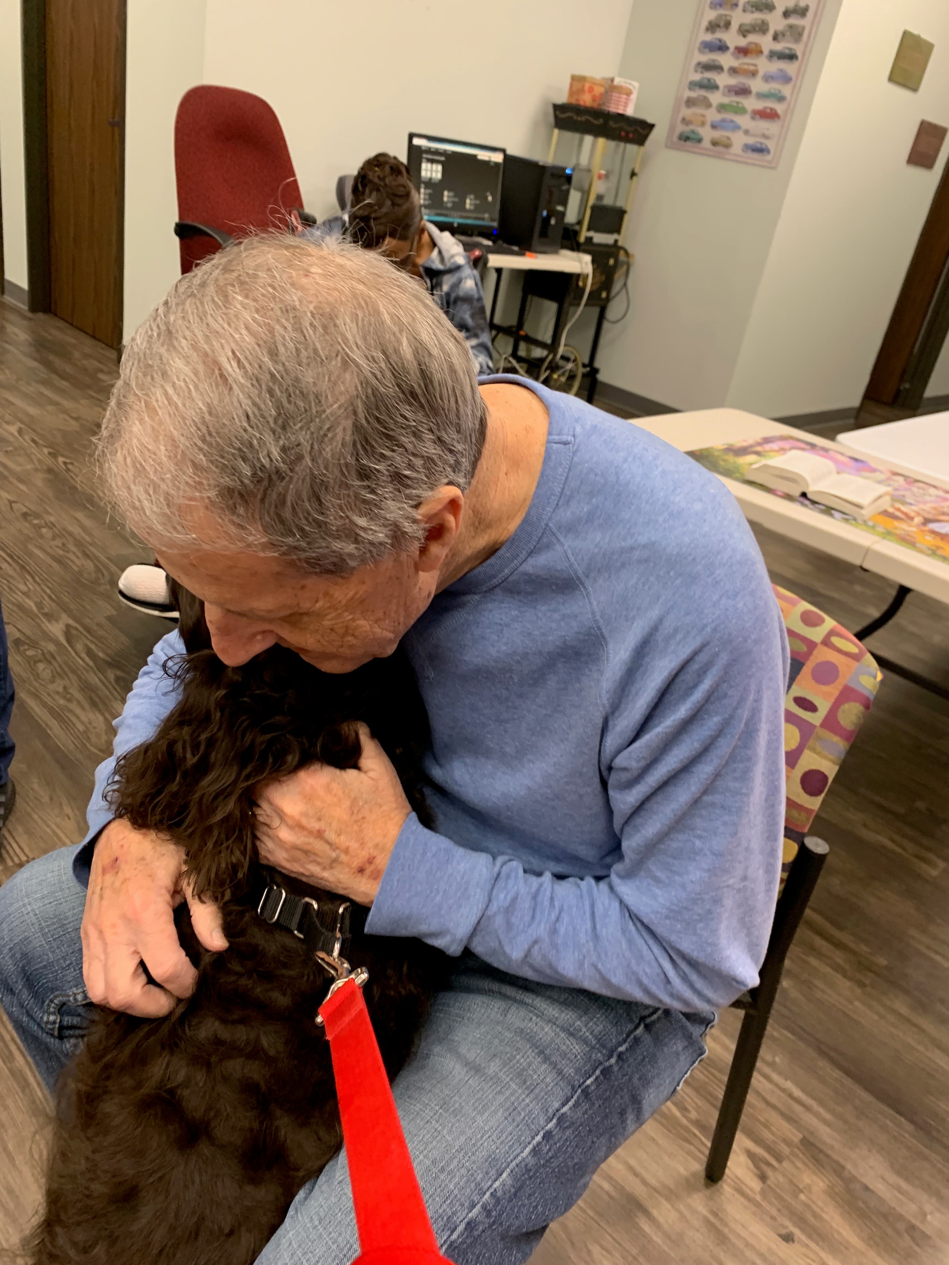 Covey, an Angel Paws therapy dog who visits assisted living facilities