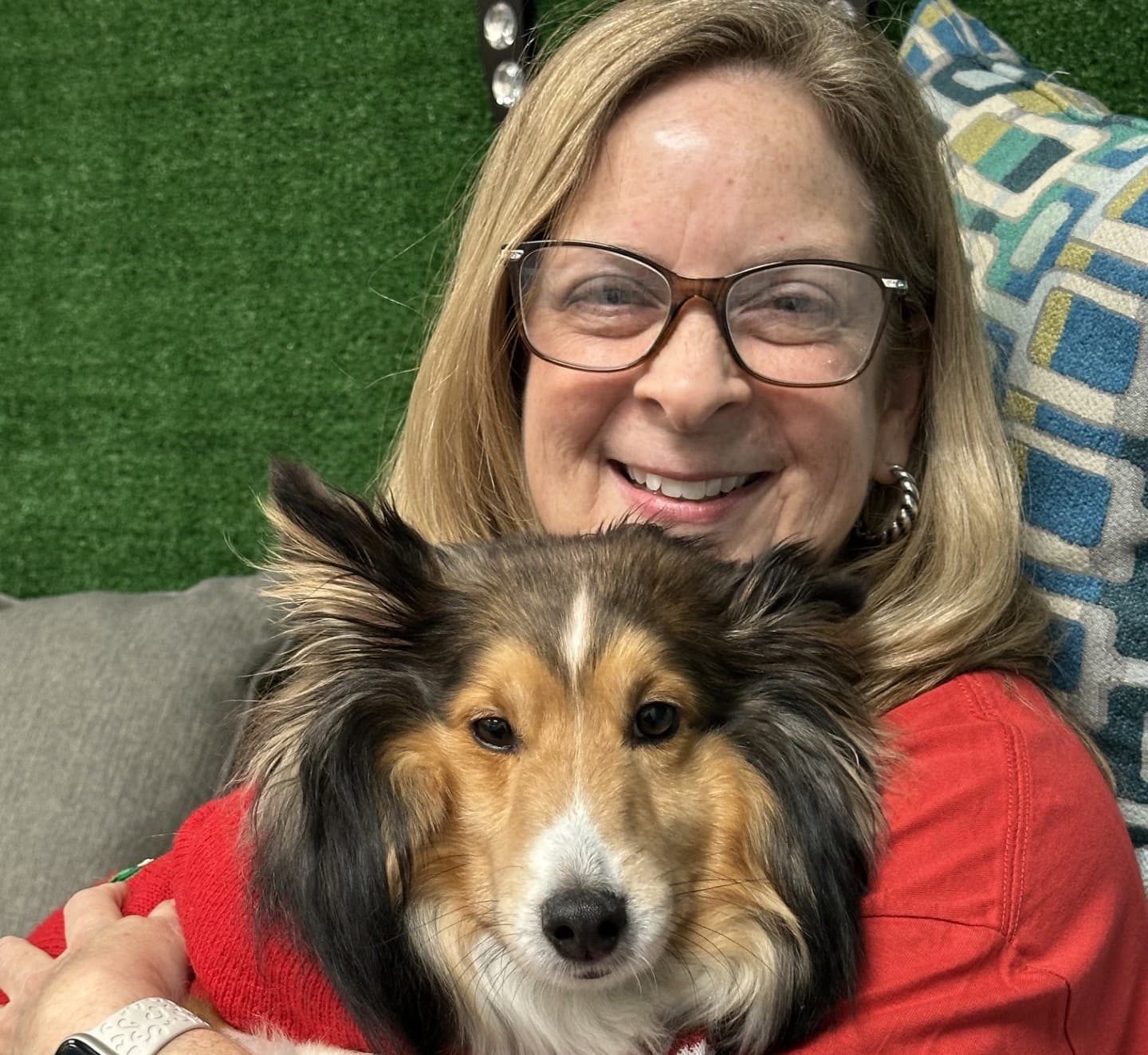 Adrai Stacha with an Angel Paws therapy dog